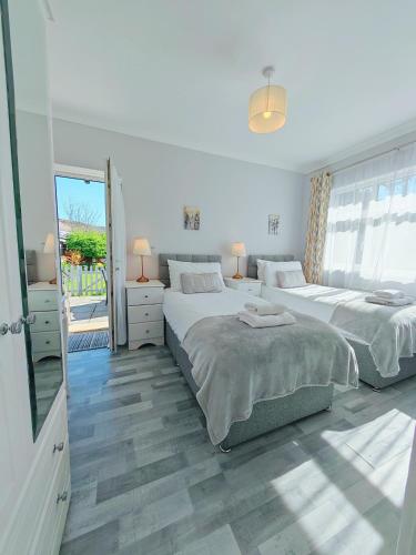 Ένα ή περισσότερα κρεβάτια σε δωμάτιο στο Bungalow Step Free Access - Close To The Beach
