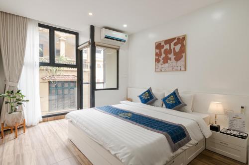 Ένα ή περισσότερα κρεβάτια σε δωμάτιο στο Thùy Dung Hotel & Apartment Mễ Trì