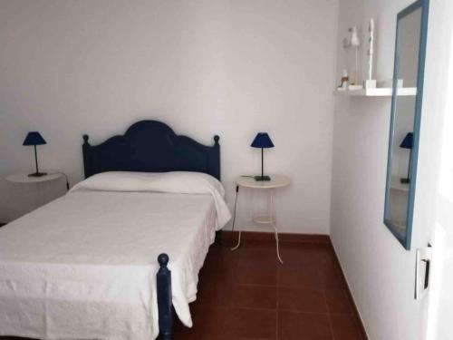 Ένα ή περισσότερα κρεβάτια σε δωμάτιο στο GuestReady - Cheerful Ponta Delgada townhouse