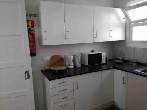 Η κουζίνα ή μικρή κουζίνα στο GuestReady - Cheerful Ponta Delgada townhouse