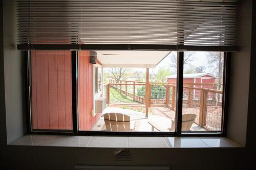 a window in a room with a view of a patio at Riverwood Resort on the Gunnison in Delta
