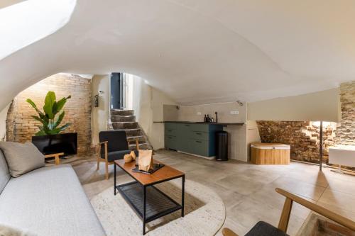 a living room with a couch and a table at Unique underground hotel in Utrecht city center in Utrecht