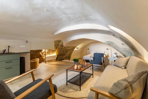 a living room with a couch and a table at Unique underground hotel in Utrecht city center in Utrecht