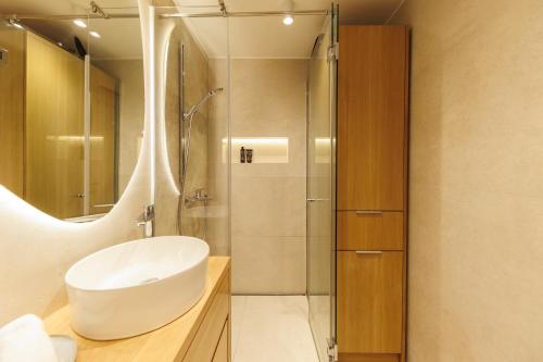 a bathroom with a sink and a shower at Apartment Puntamica in Zadar