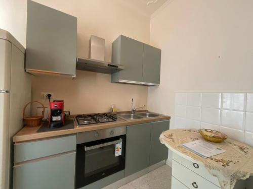 a small kitchen with a sink and a stove at Oasi Venus Perugia e Assisi in Ponte San Giovanni