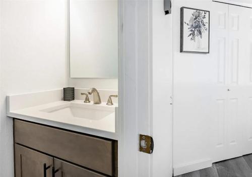 a white bathroom with a sink and a mirror at Oceanview Birch Bay 2 Bedroom at Jacobs Landing in Blaine