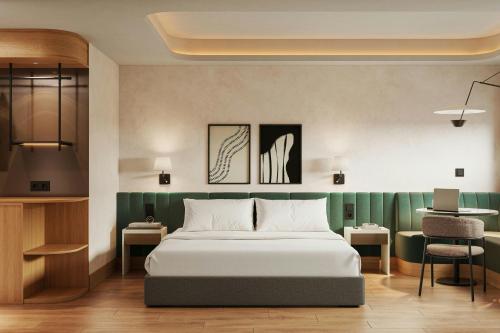 a bedroom with a bed and a table and a chair at Salitre Hotel, Sonder by Marriott Bonvoy in Málaga