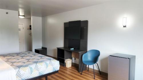 Ένα ή περισσότερα κρεβάτια σε δωμάτιο στο Motel 6-Ennis, TX