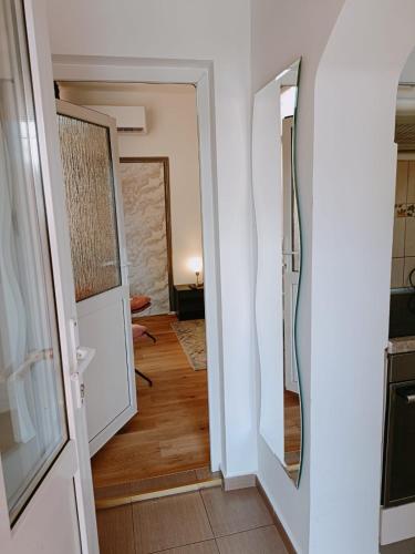 a hallway with two mirrors in a room at Ana's Garden Sibiu in Sibiu