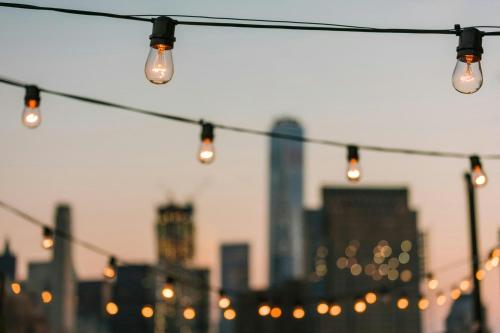 a string of lights with a city in the background at Salitre Hotel, Sonder by Marriott Bonvoy in Málaga