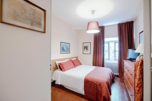 a hotel room with a bed and a window at Villa Solzago - by MyHomeInComo in Tavernerio