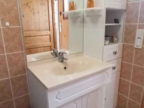 a bathroom with a sink and a mirror at Appartement indépendant à Saran, proche Orléans - FR-1-590-574 in Saran