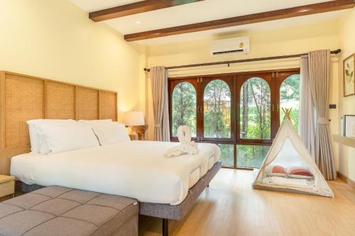 Postel nebo postele na pokoji v ubytování Miranda's House Khaokho มิรันดาเฮ้าส์ เขาค้อ