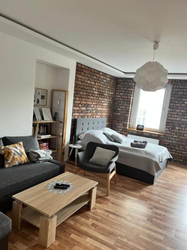 Posteľ alebo postele v izbe v ubytovaní Apartament Pogodny
