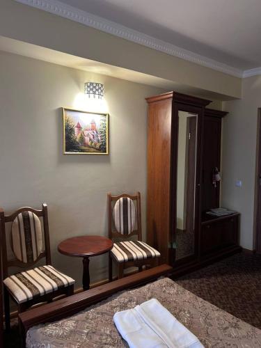 Ένα ή περισσότερα κρεβάτια σε δωμάτιο στο Hotel Three Korony