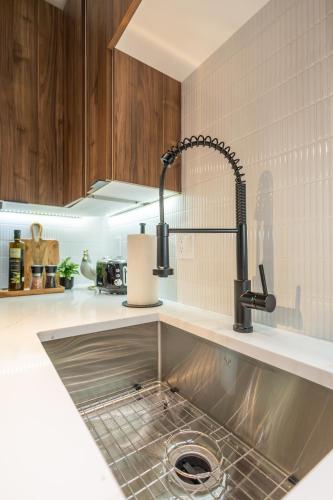 a kitchen with a sink and aaucet at 2BR2Bth 2 Parking Spaces,TD Garden,MIT,Harvard,BOS in Somerville