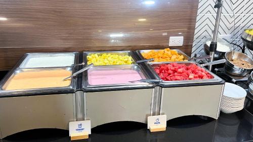 a buffet with different types of fruits in trays at Holiday Inn Express Culiacan by IHG in Culiacán