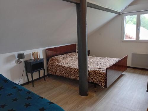 Postel nebo postele na pokoji v ubytování les chalets Lololange