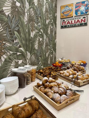 a table with many different types of bread and pastries at Hotel Eureka in Rimini