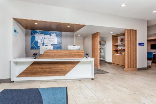 a lobby of a hospital with a reception desk at Holiday Inn Express & Suites Palm Coast - I-95 in Palm Coast