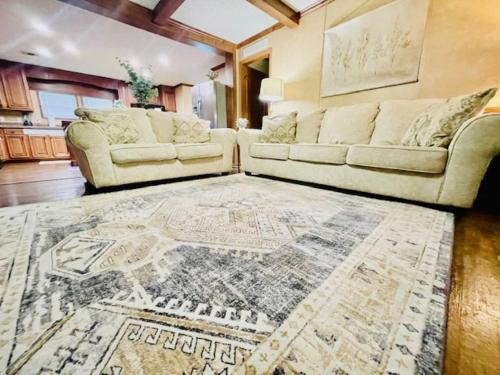 a living room with a couch and a rug at Mark House in Hammond
