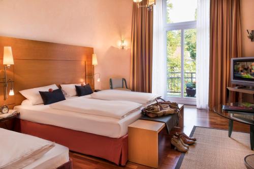 Postel nebo postele na pokoji v ubytování Hotel Vorbach