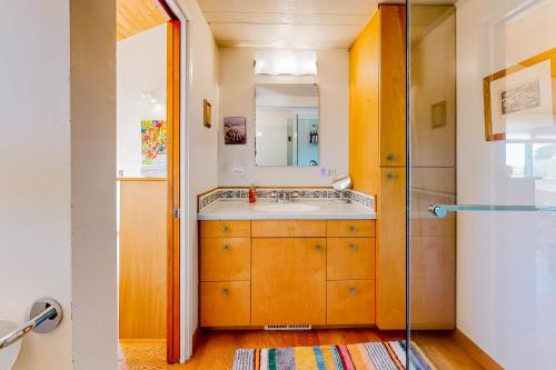 a bathroom with a sink and a mirror at Cadwalader House in Sea Ranch