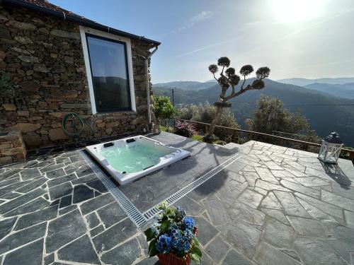 a house with a swimming pool on a patio at Casinha Serabigoes Arouca Passadiços Paiva in Arouca