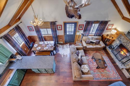 an overhead view of a living room with a couch and table at Moose Tracks Cabin Hot Tub 1 Mile To Lake in Lake Harmony