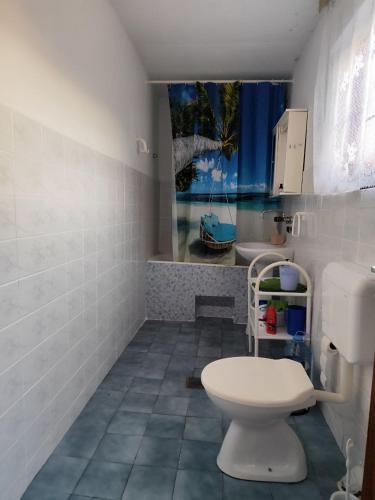 a bathroom with a toilet and a sink at Wisteria in Tivat