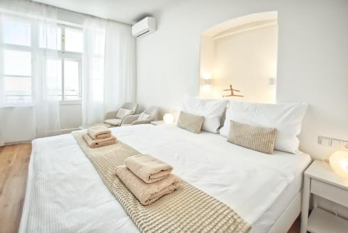 Postel nebo postele na pokoji v ubytování Apartmány VIENNA