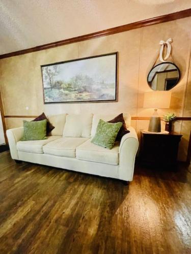 a white couch sitting in a living room at Mark House in Hammond