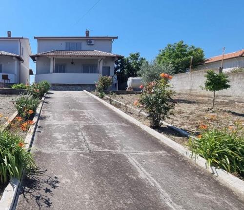 an empty road in front of a house at Villa VVG in Koxhas