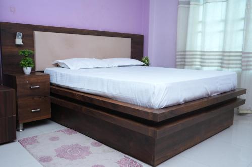 Ένα ή περισσότερα κρεβάτια σε δωμάτιο στο Simsar Villa Homestay