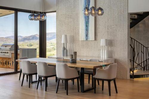 a kitchen and dining room with a table and chairs at W Costa Rica Resort – Playa Conchal in Playa Conchal
