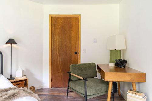 a bedroom with a desk and a chair and a table at The Lily Pad - Hunter NY in Elka Park
