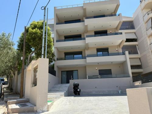 a motorcycle parked in front of a building at Comfort SpataAir Stay in Spáta