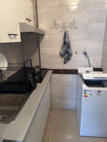 a kitchen with a sink and a counter top at Bernat in Puławy