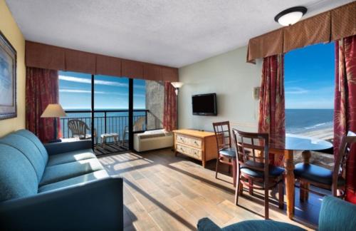 a living room with a view of the ocean at Monterey Bay Suites in Myrtle Beach