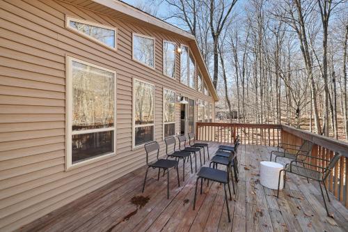 a deck with chairs and windows on a house at Serene Escape At Big Bass Lake & Pool Access in Clifton
