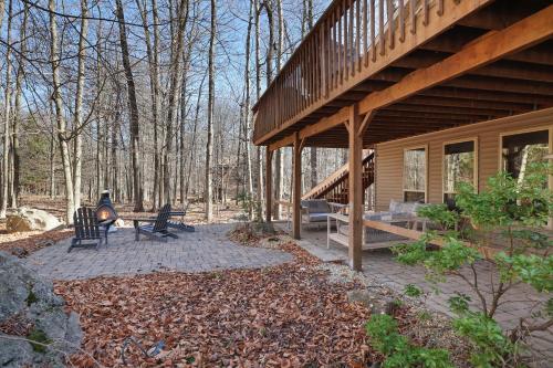 a porch of a house with two chairs and a staircase at Serene Escape At Big Bass Lake & Pool Access in Clifton