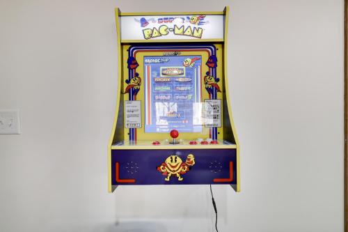 a game room with a claw machine in a museum at Serene Escape At Big Bass Lake & Pool Access in Clifton