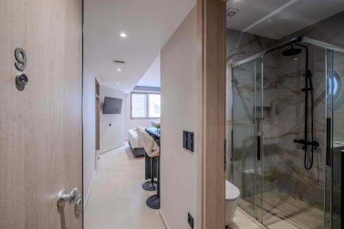 a bathroom with a shower and a toilet at Agora Views in Athens