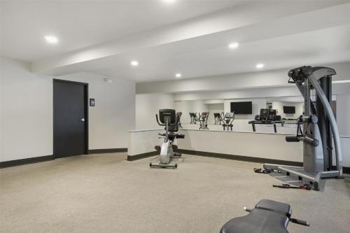 a gym with exercise equipment in a room at Best Western Seattle Airport Hotel in SeaTac