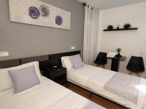 Katil atau katil-katil dalam bilik di Hostal Turbon
