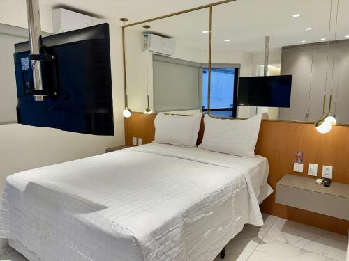 Giường trong phòng chung tại Edifício Tenerife - 607 Mandi Hospitalidade