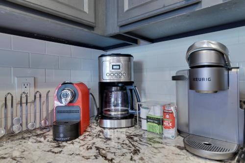 a kitchen counter with a coffee maker and a mixer at Mountainview Vista 1 Mile To Water Park & Ski in Tannersville