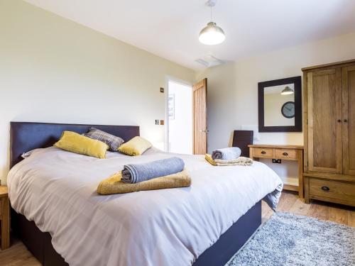 a bedroom with two beds with pillows on them at 2 Bed in South Molton 78097 in South Molton