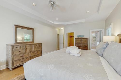 a large bedroom with a large bed and a dresser at 3074 Baywood in Seabrook Island
