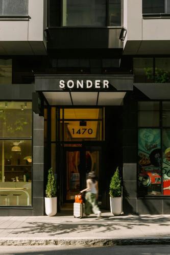 a person walking in front of a store at Sonder by Marriott Bonvoy Maisonneuve Apartments Downtown in Montréal